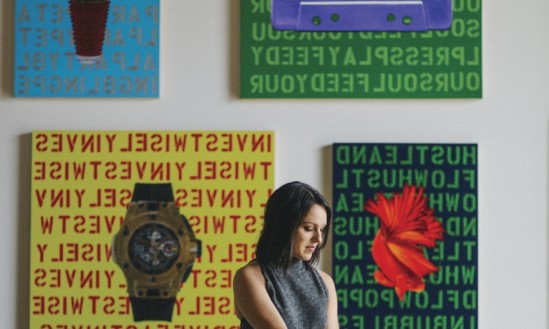 Houston-based fine artist Angela Fabbri standing in front of some of her work