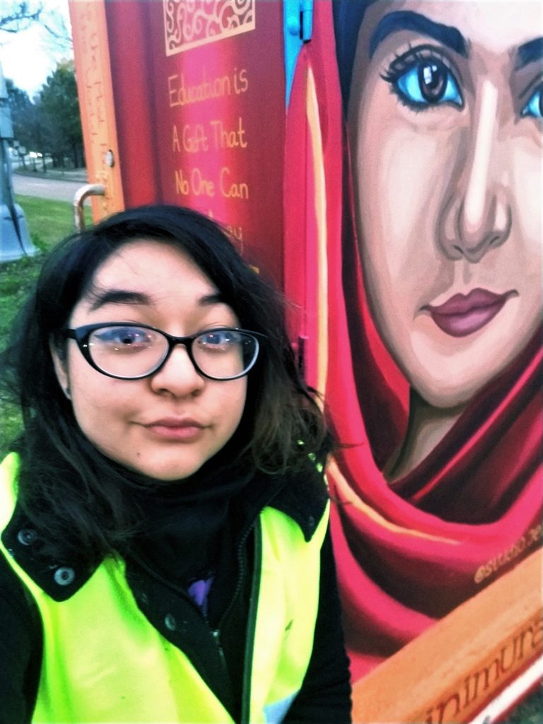 Mural of Malala Yousafzai with artist Jessica Padilla