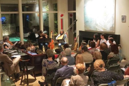 Chamber group performing in house concert