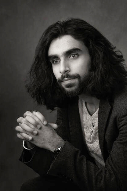 Black and white image of composer Milad Yousufi