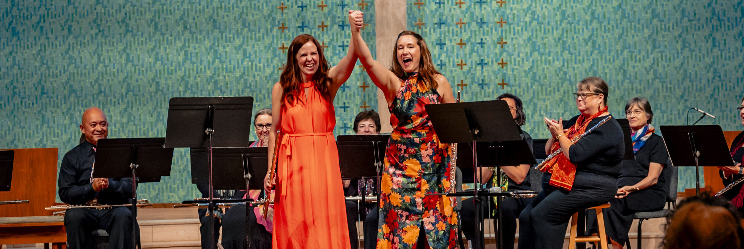 Rebecca Powell Garfield and Brook Ferguson celebrating after a concert.
